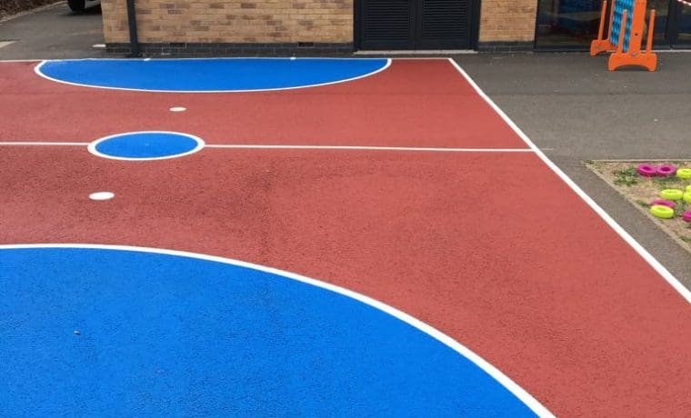 mini football pitch line marking on colour coated pitch in school in RCT