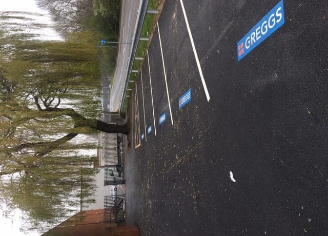 corporate logos, car park markings, car park bays