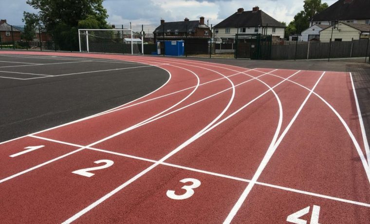 Athletics line marking in Cardiff, 100m sprint lanes and 400m track